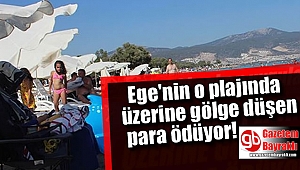 Ege'nin o plajında üzerine gölge düşen para ödüyor