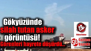 Gökyüzünde silah tutan asker görüntüsü