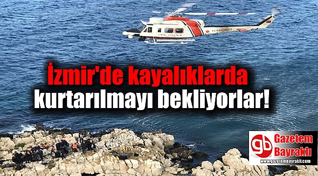 İzmir'de kayalıklarda kurtarılmayı bekliyorlar