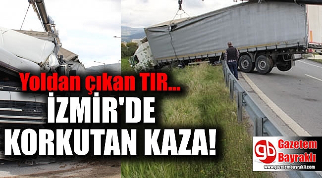 İzmir'de yoldan çıkan TIR, bariyerlerde asılı kaldı