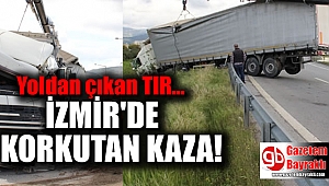 İzmir'de yoldan çıkan TIR, bariyerlerde asılı kaldı
