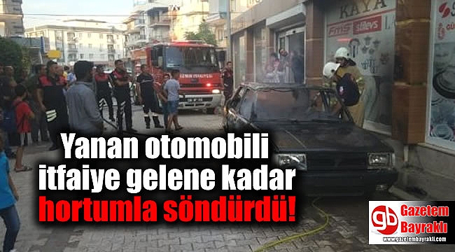 Yanan otomobili itfaiye gelene kadar hortumla söndürdü