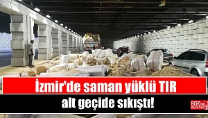 İzmir'de saman yüklü TIR alt geçide sıkıştı