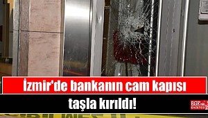 İzmir'de bankanın cam kapısı taşla kırıldı