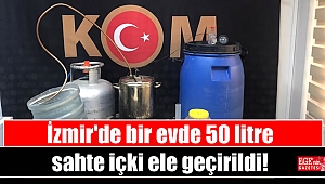 İzmir'de bir evde 50 litre sahte içki ele geçirildi